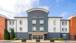 A hotel with a modern design, featuring a prominent logo and the name "Candlewood Suites" on the facade. - Candlewood Suites Chambersburg by IHG (Chambersburg)
