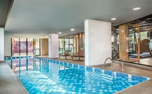 Indoor pool, open 6:00 AM to 8:00 PM, pool loungers