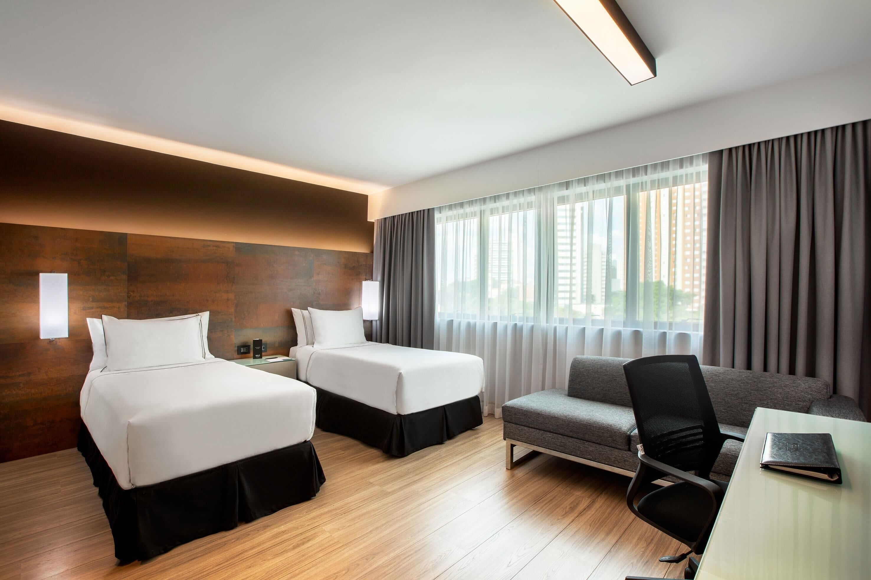 Deluxe Twin kamer | Lakens van Egyptisch katoen, luxe beddengoed, een minibar