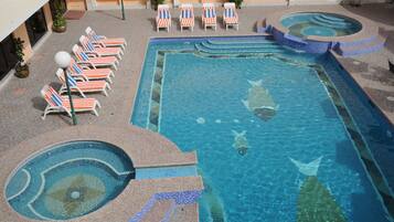 Outdoor pool, open 7:00 AM to 6:30 PM, pool umbrellas