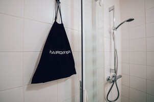 Shower, eco-friendly toiletries, hair dryer, towels
