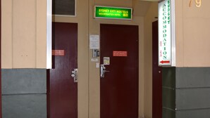 The entrance to Sydney City Hotels with a sign above the doors. - Sydney City Hostel (Haymarket)