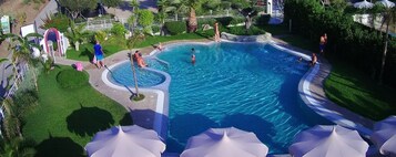 Outdoor pool, pool umbrellas, sun loungers