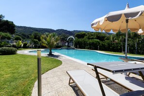 Outdoor pool, pool umbrellas, sun loungers