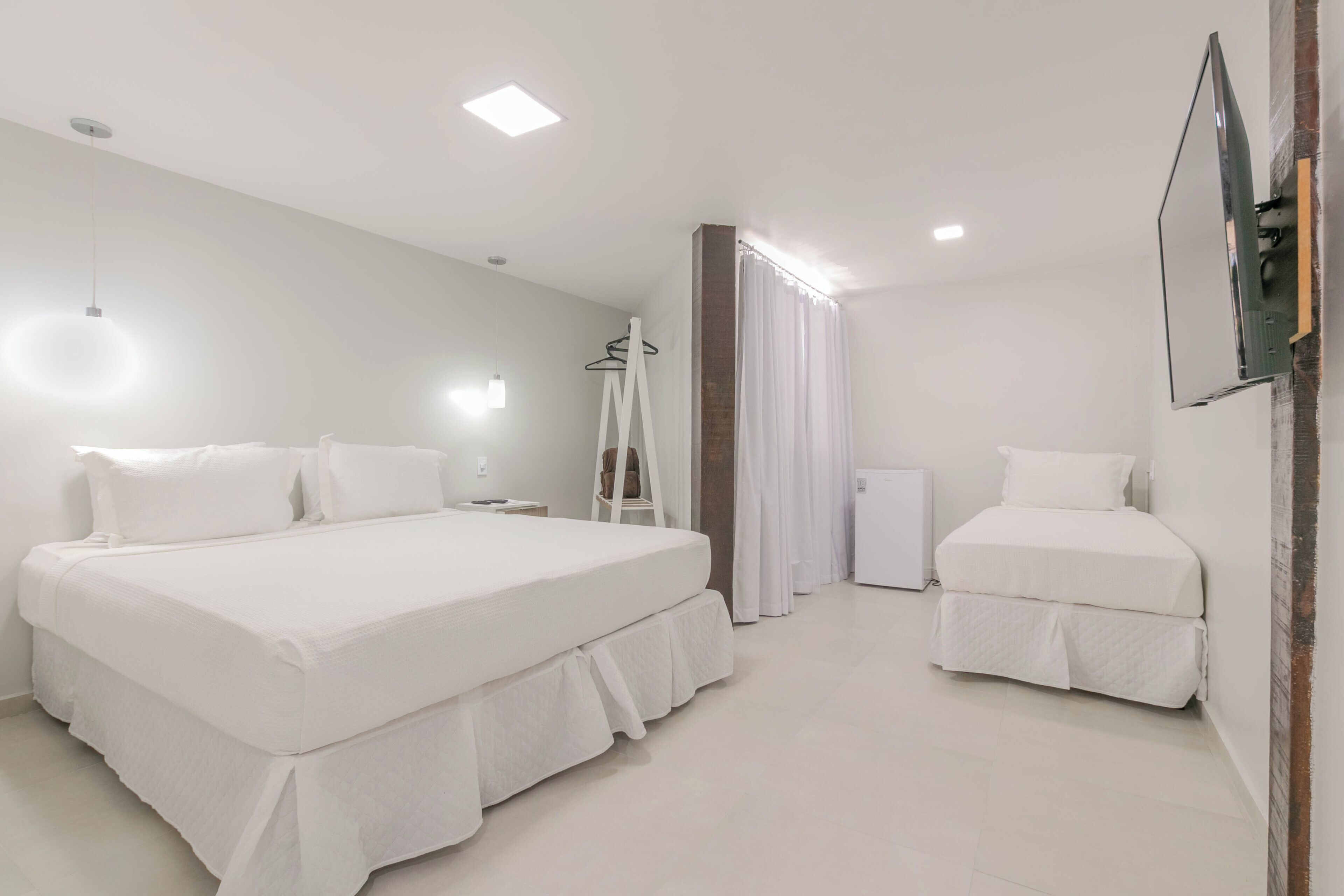 Deluxe Triple Room | Minibar, in-room safe, individually decorated, free WiFi