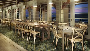 A restaurant with wooden tables and chairs, large windows, and hanging pendant lights. - Resorts World Langkawi (Langkawi)