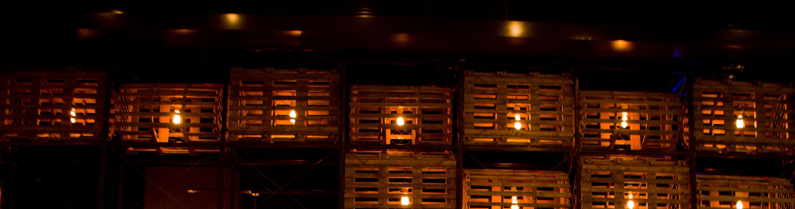 Stacks of wooden crates with visible openings, possibly used for storage or transport.