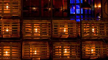 Stacked wooden crates with visible light fixtures inside.