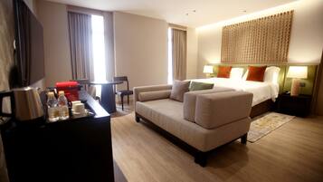 Desk, iron/ironing board, bed sheets