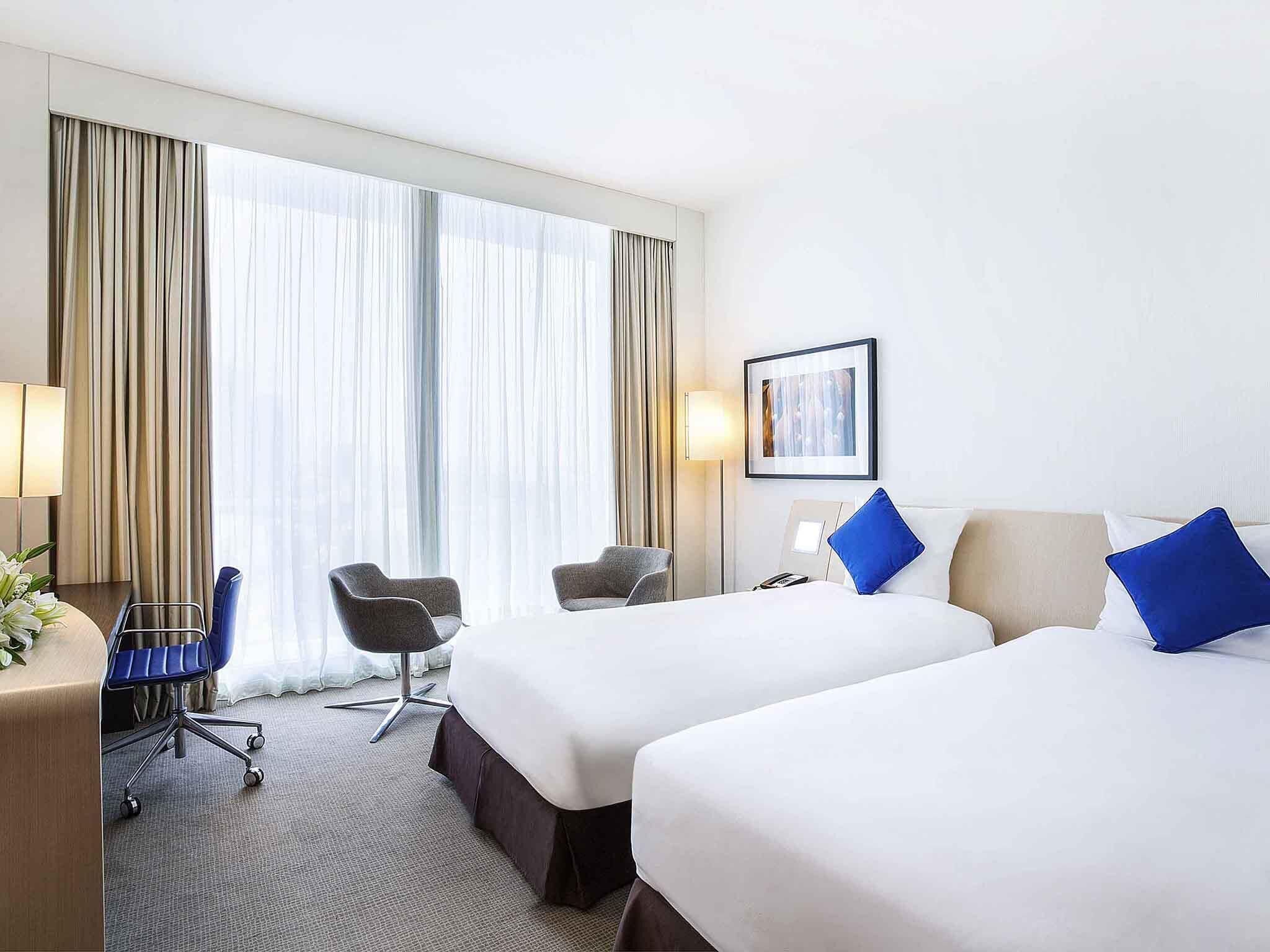 Superior Twin Room | Minibar, in-room safe, individually decorated, desk