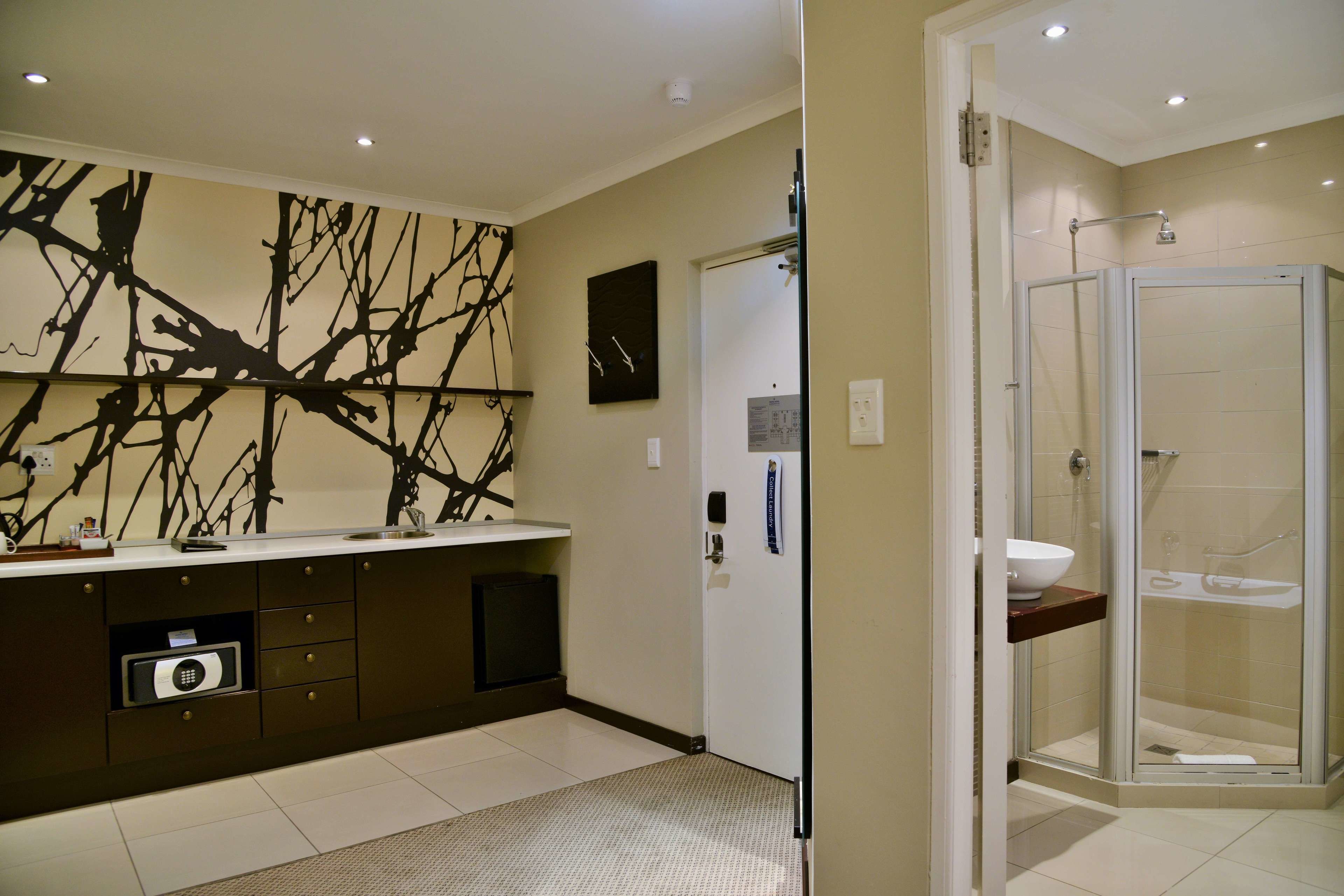 room, 1 king bed | bathroom | rainfall showerhead, free toiletries, hair dryer, towels