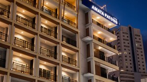 A multi-story hotel with balconies and a sign reading "AMATA PATONG". - Amata Patong (Patong)