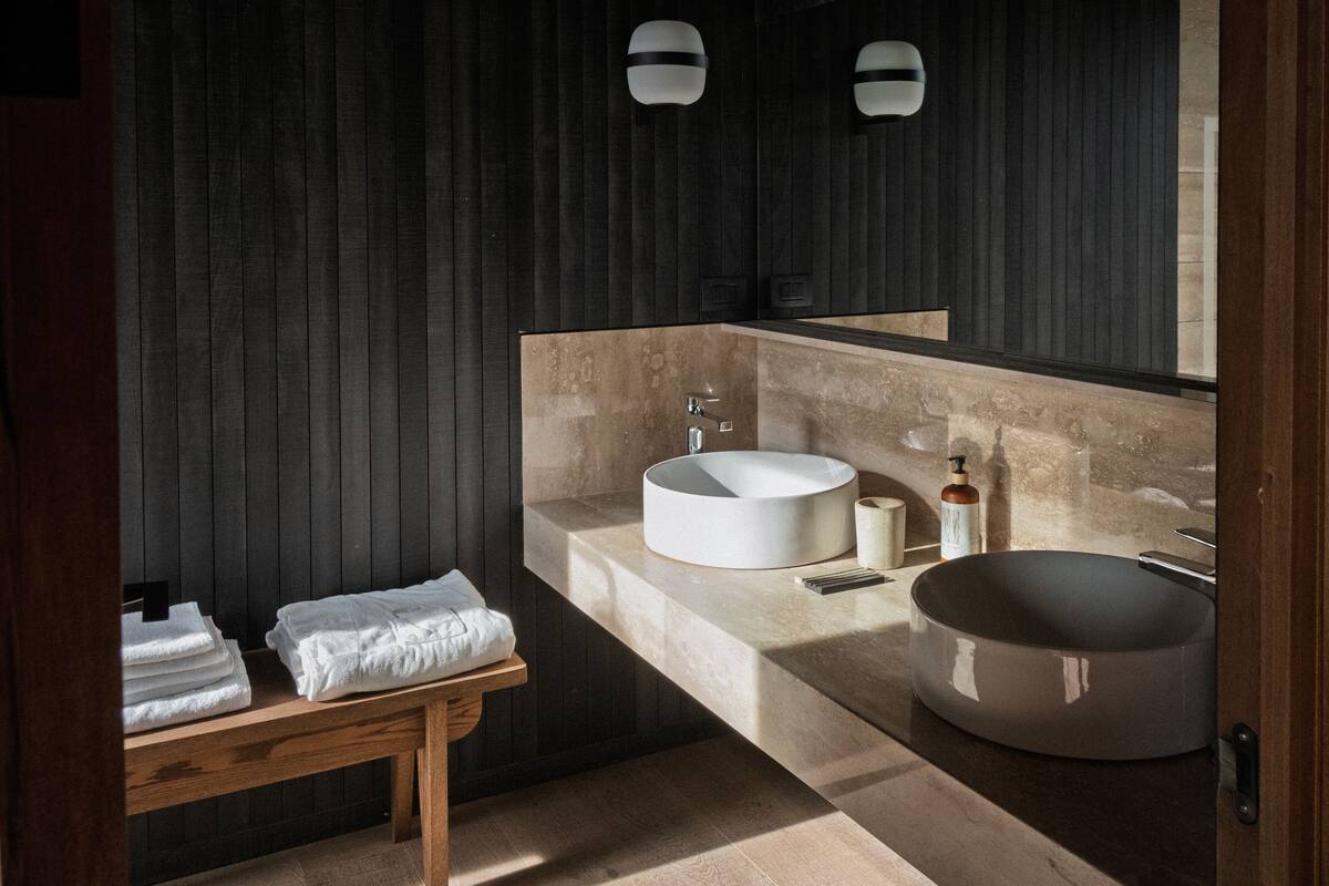 deep-soaking bathtub, rainfall showerhead, designer toiletries