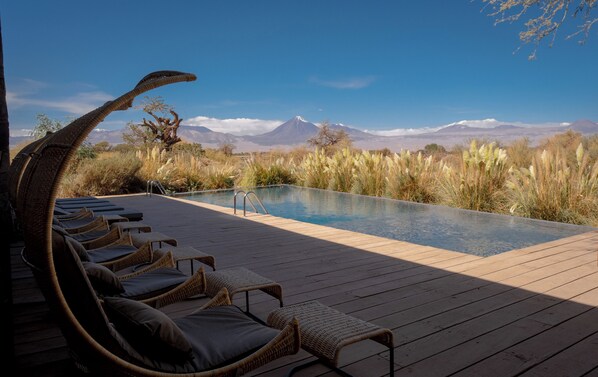 Indoor pool, outdoor pool, open 9:00 AM to 9:00 PM, pool umbrellas