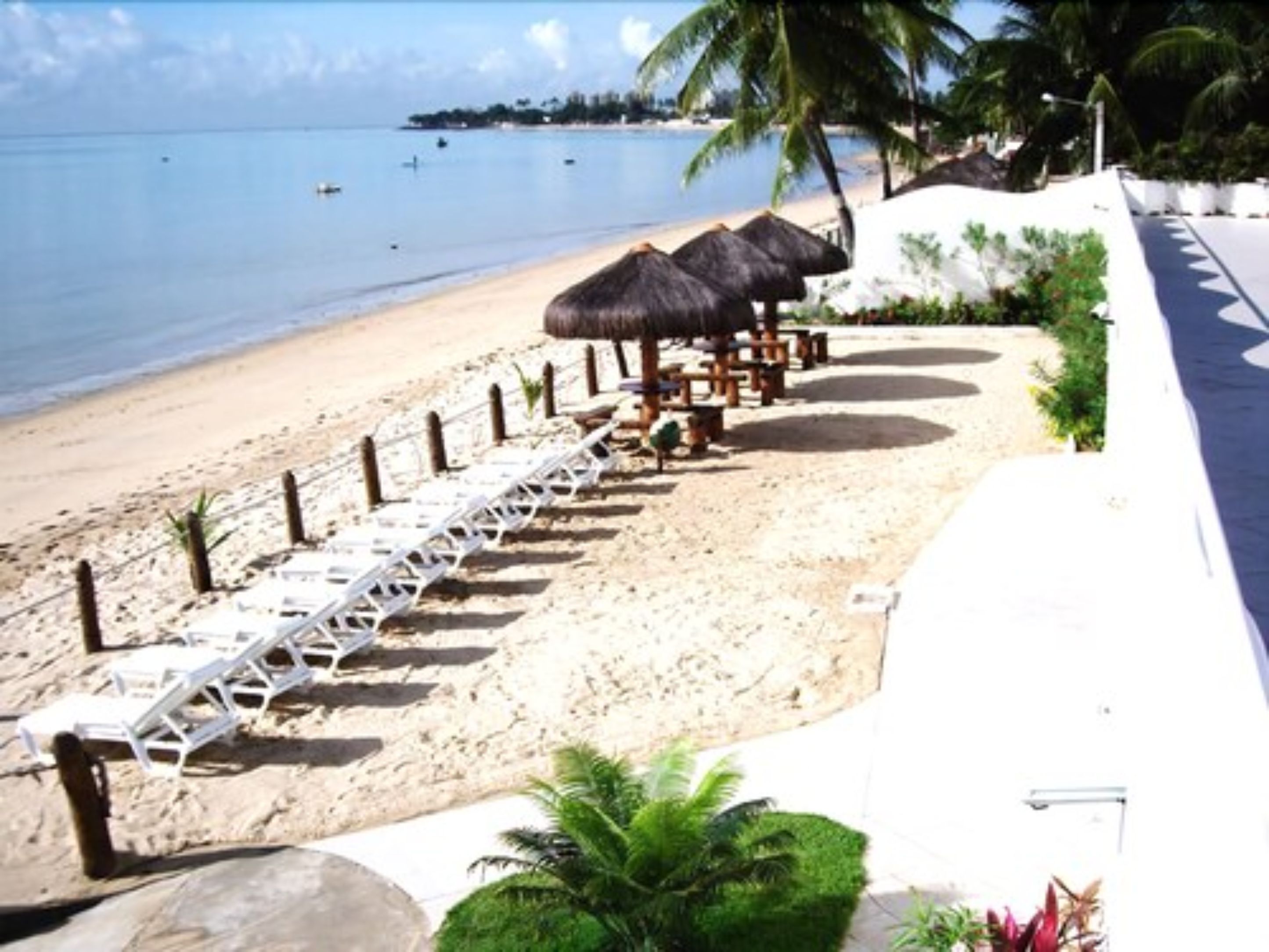 On the beach, sun-loungers, beach umbrellas, beach towels