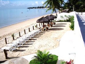 On the beach, sun loungers, beach umbrellas, beach towels