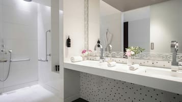 Designer toiletries, hair dryer, bathrobes, slippers