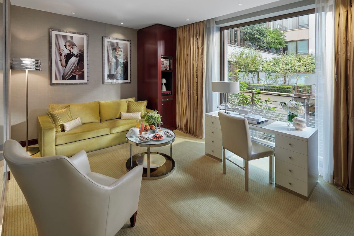 Deluxe Suite | Living area | 107-cm LCD TV with digital channels, TV, video-game console
