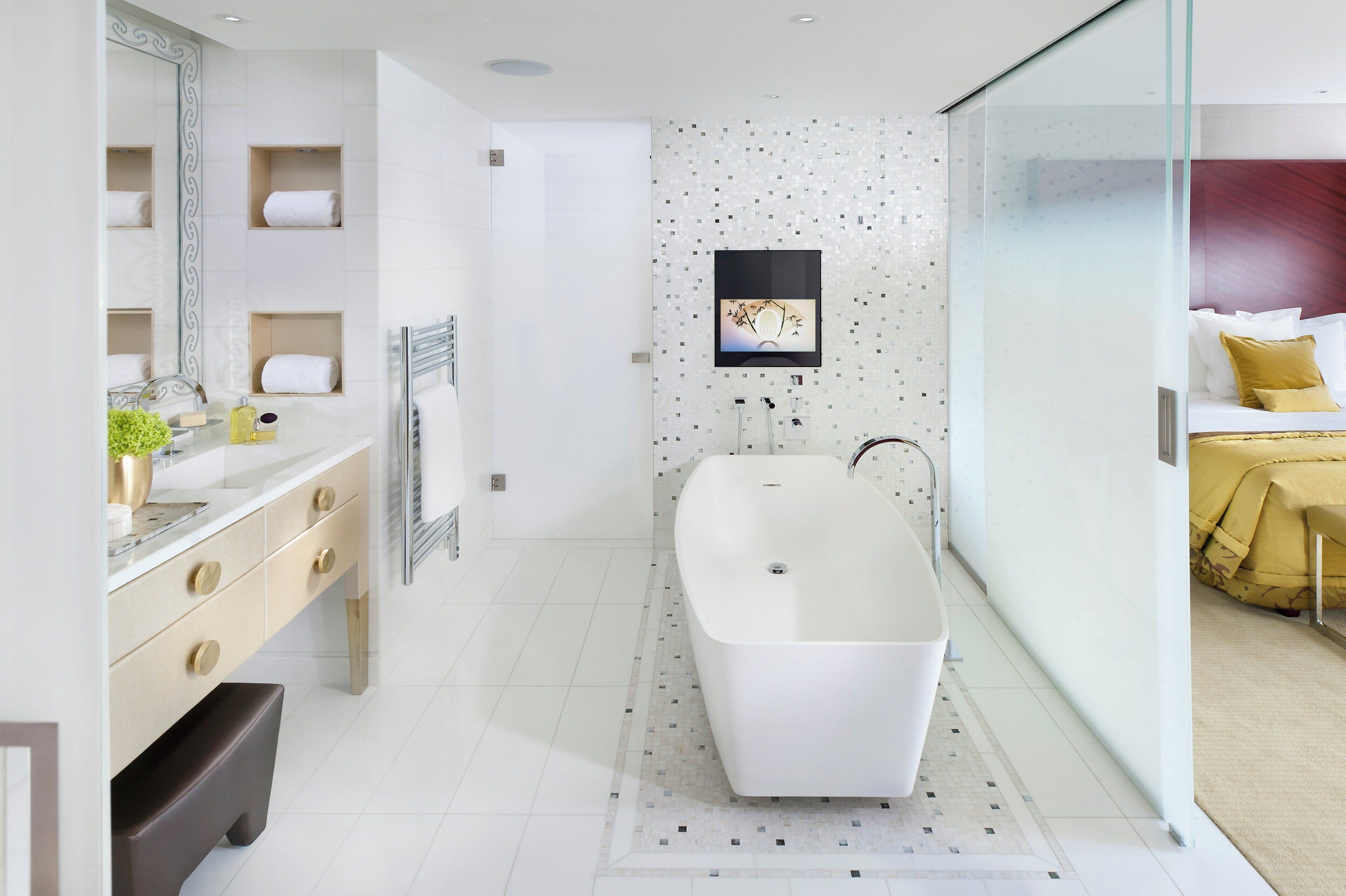 Deluxe Suite | Bathroom | Designer toiletries, hair dryer, bathrobes, slippers