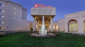 A Hilton Garden Inn with a central fountain, large columns, and a well-lit entrance. - Hilton Garden Inn Mardin (Mardin)