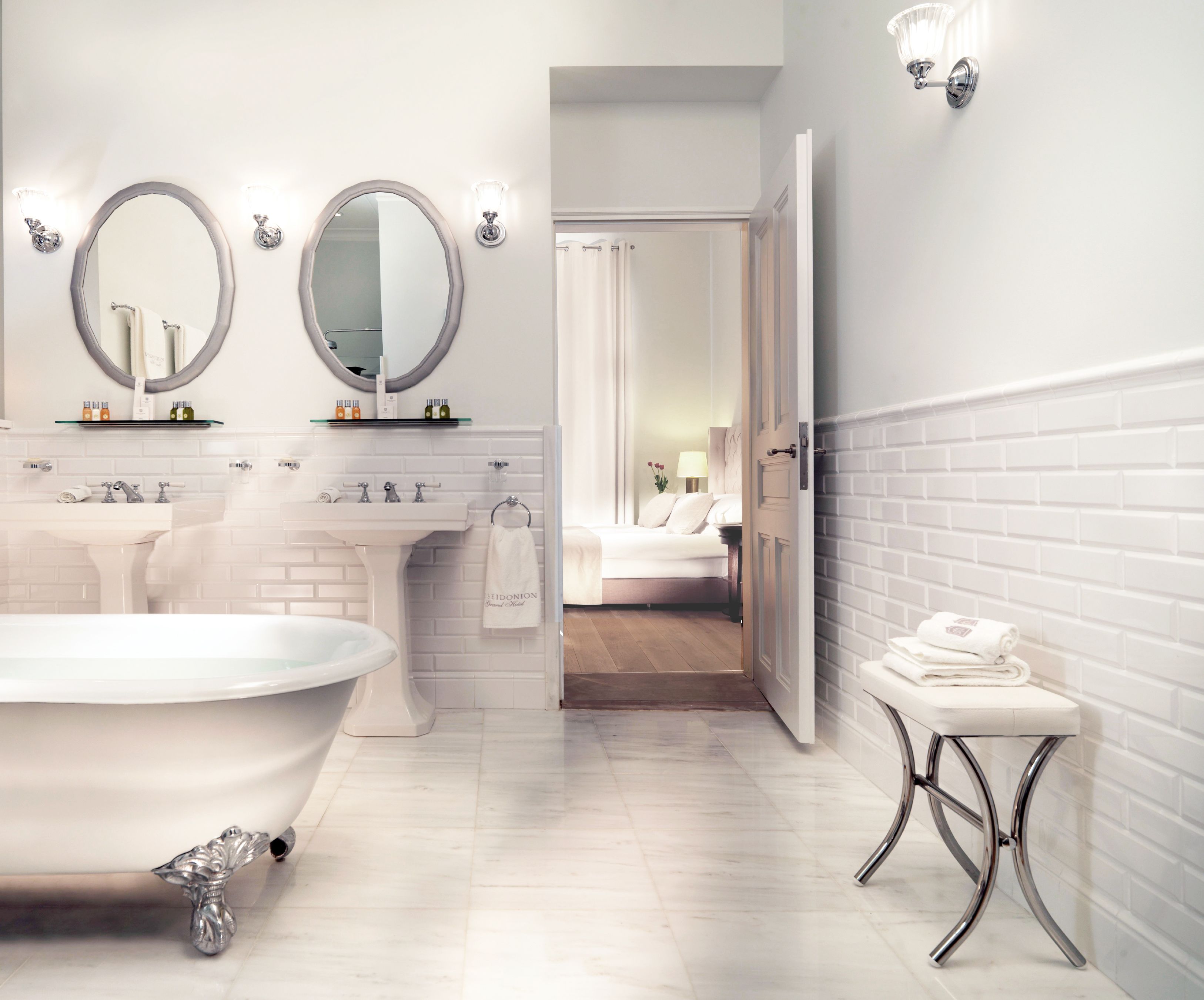 superior suite | bathroom | combined shower/bathtub, designer toiletries, hair dryer, bathrobes