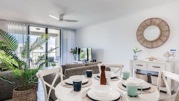 2 Bedroom Apartment Pool Views | Living area | Flat-screen TV, DVD player