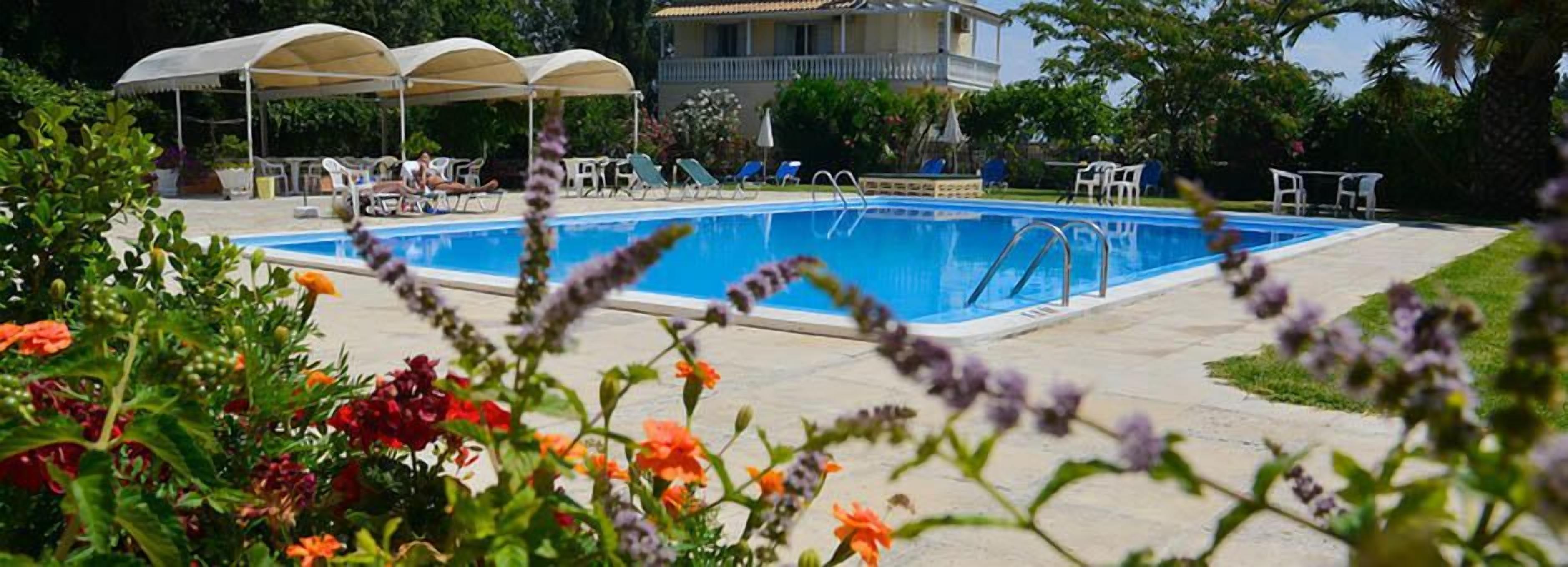 Seasonal outdoor pool, open 10 AM to 8 PM, pool umbrellas, pool loungers