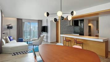 Suite, 2 Bedrooms, City View (Ultra Savvy Suite) | Living room | 55-inch TV with satellite channels
