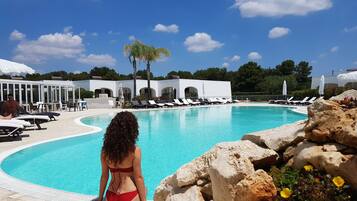 Seasonal outdoor pool, open 9:00 AM to 7:00 PM, pool umbrellas