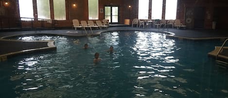 Indoor pool, open 10:00 AM to 10:00 PM, pool loungers