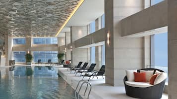 Indoor pool, open 6 AM to 11 PM, pool loungers