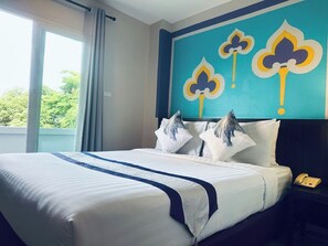 A hotel room with a bed, a nightstand, a telephone, and a window with curtains. - Sawasdee Hotel @ Sukhumvit Soi 8 (Bangkok)