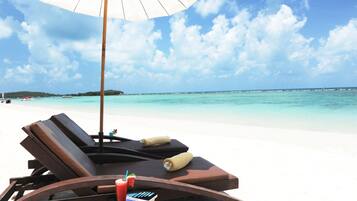 On the beach, beach umbrellas, beach towels, beach bar