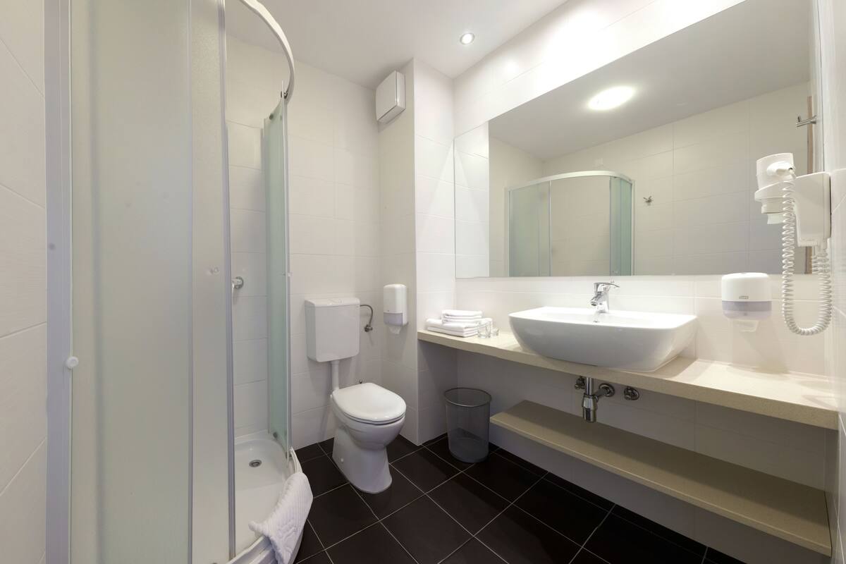 family room | bathroom | shower, hair dryer, towels