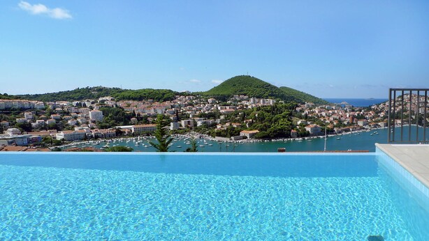 Indoor pool, seasonal outdoor pool, open 9 AM to 8 PM, pool umbrellas