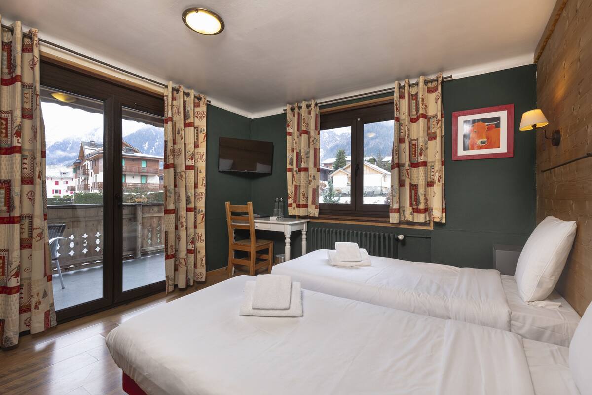quadruple room, terrace mont-blanc view | in-room safe, desk, soundproofing, iron/ironing board