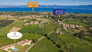 An aerial view of a vineyard area with labeled locations such as Movieland, Cold di Lazise, and Parco Termale Del Garda. - Corte Pontigliardo (Lazise)