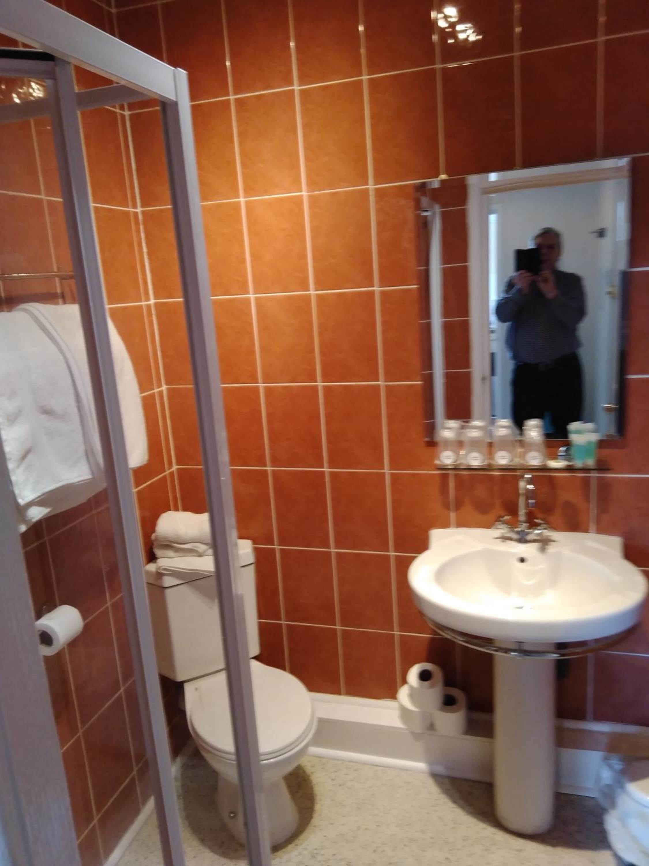 rainfall showerhead, hair dryer, towels, soap