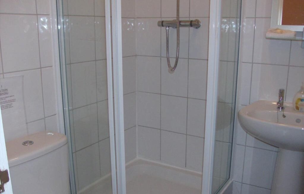 studio | bathroom | rainfall showerhead, hair dryer, towels, soap