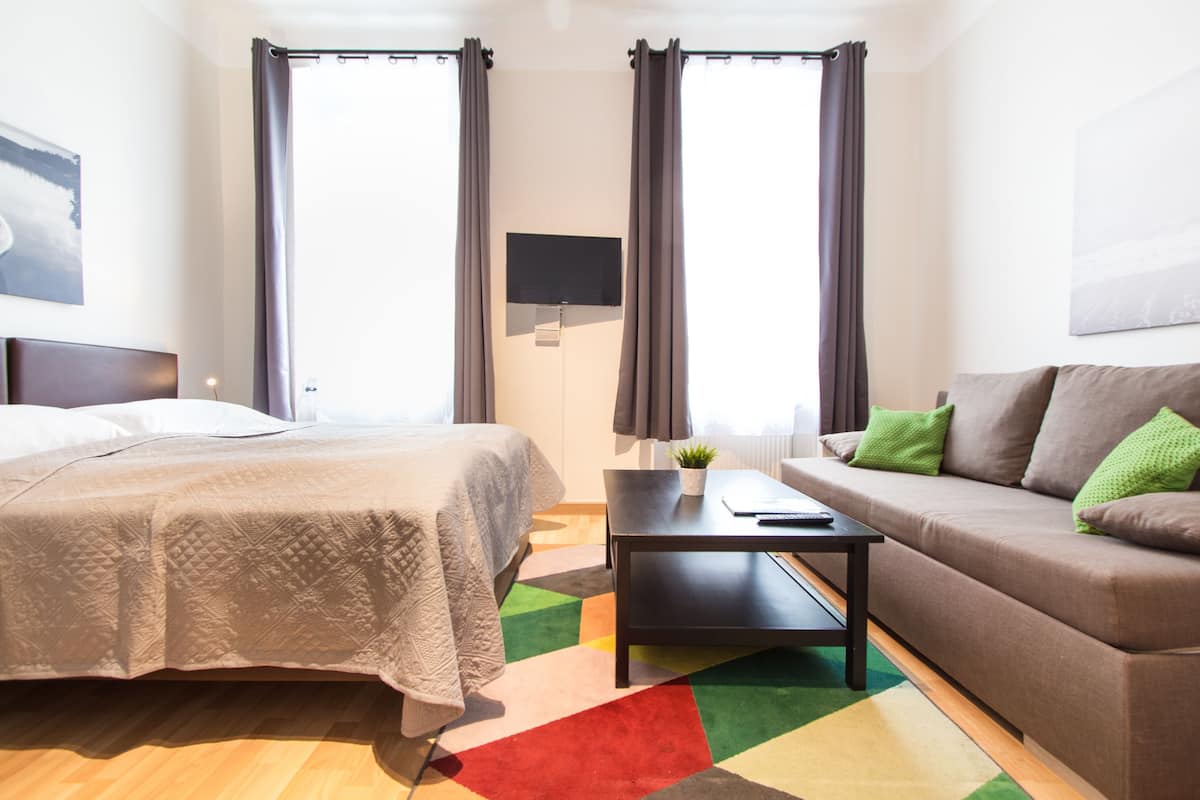 Apartment, 3 Bedrooms | Living area | 32-inch flat-screen TV with cable channels, TV