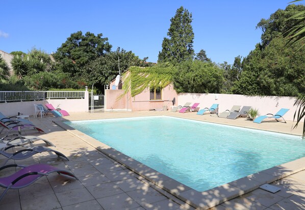 Outdoor pool, open 8:00 AM to 8:00 PM, pool umbrellas, pool loungers