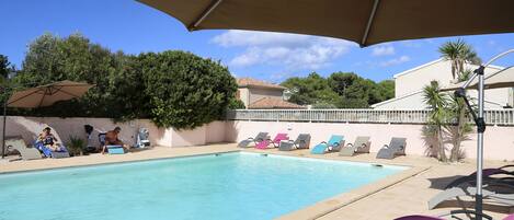 Outdoor pool, open 8:00 AM to 8:00 PM, pool umbrellas, sun loungers