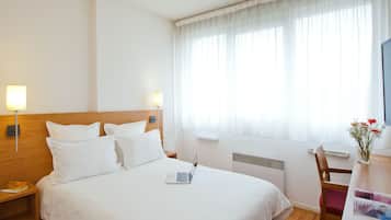 Desk, laptop workspace, free WiFi, bed sheets