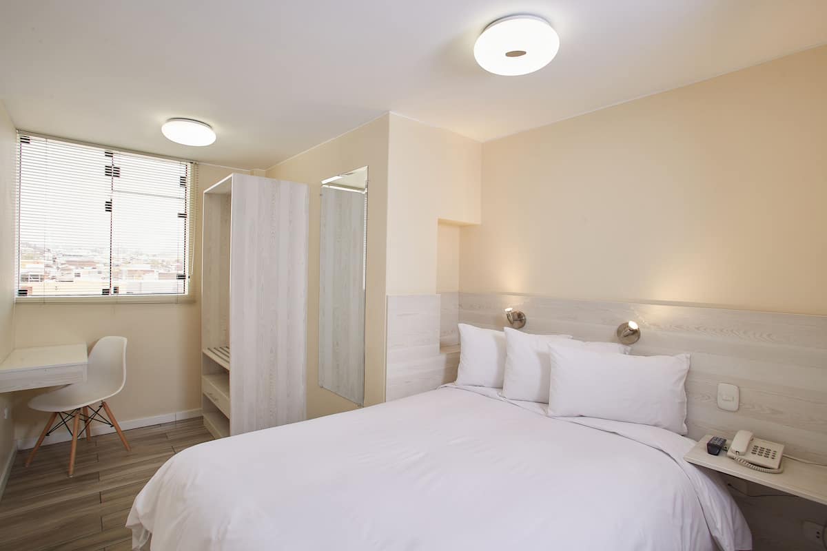 Habitación individual | Ropa de cama de alta calidad y edredón