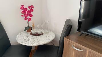 Double or Twin Room | Living area | TV