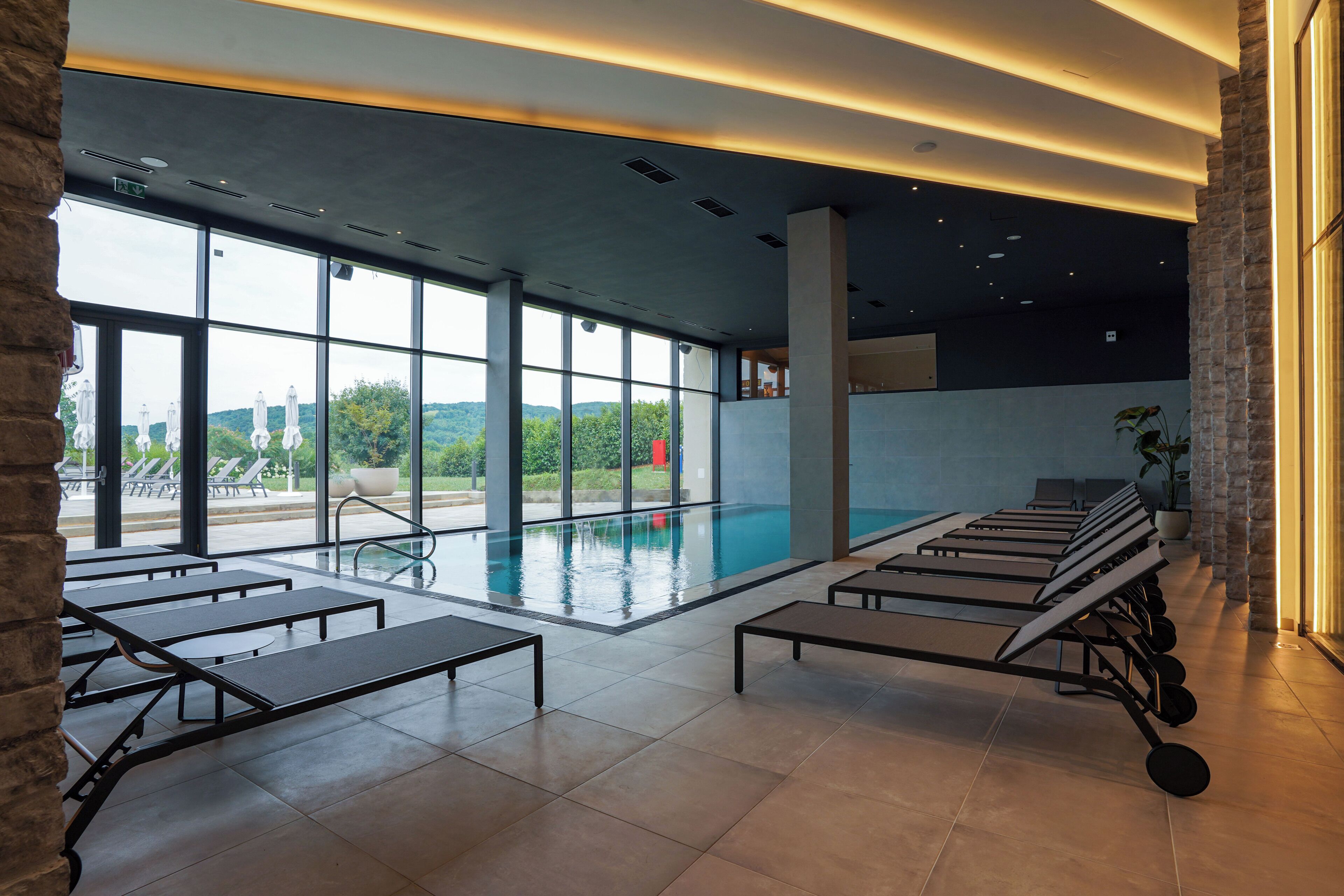 Indoor pool, seasonal outdoor pool, pool umbrellas, sun loungers