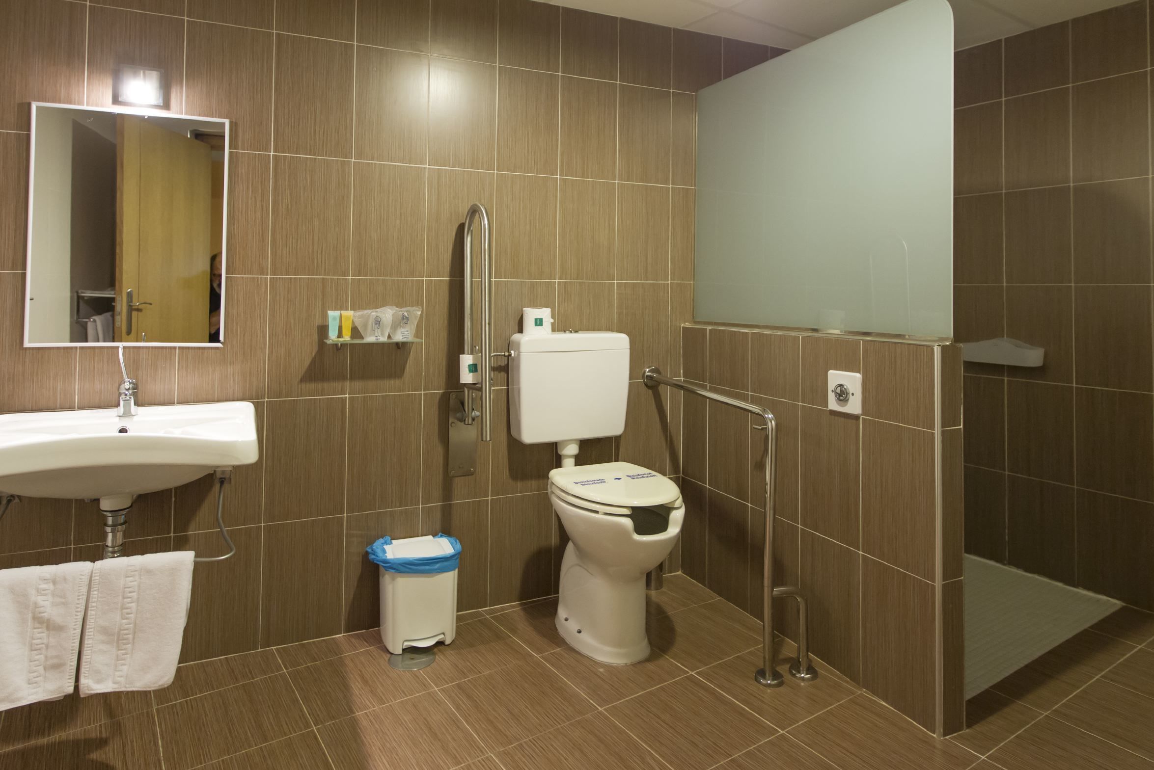 family room | bathroom | shower, rainfall showerhead, free toiletries, hair dryer