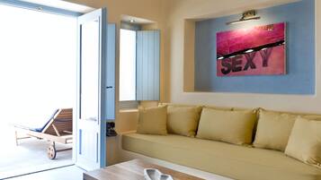 Studio Suite, Hot Tub (Midday) | Living room | 32-inch TV with digital channels, iPod dock