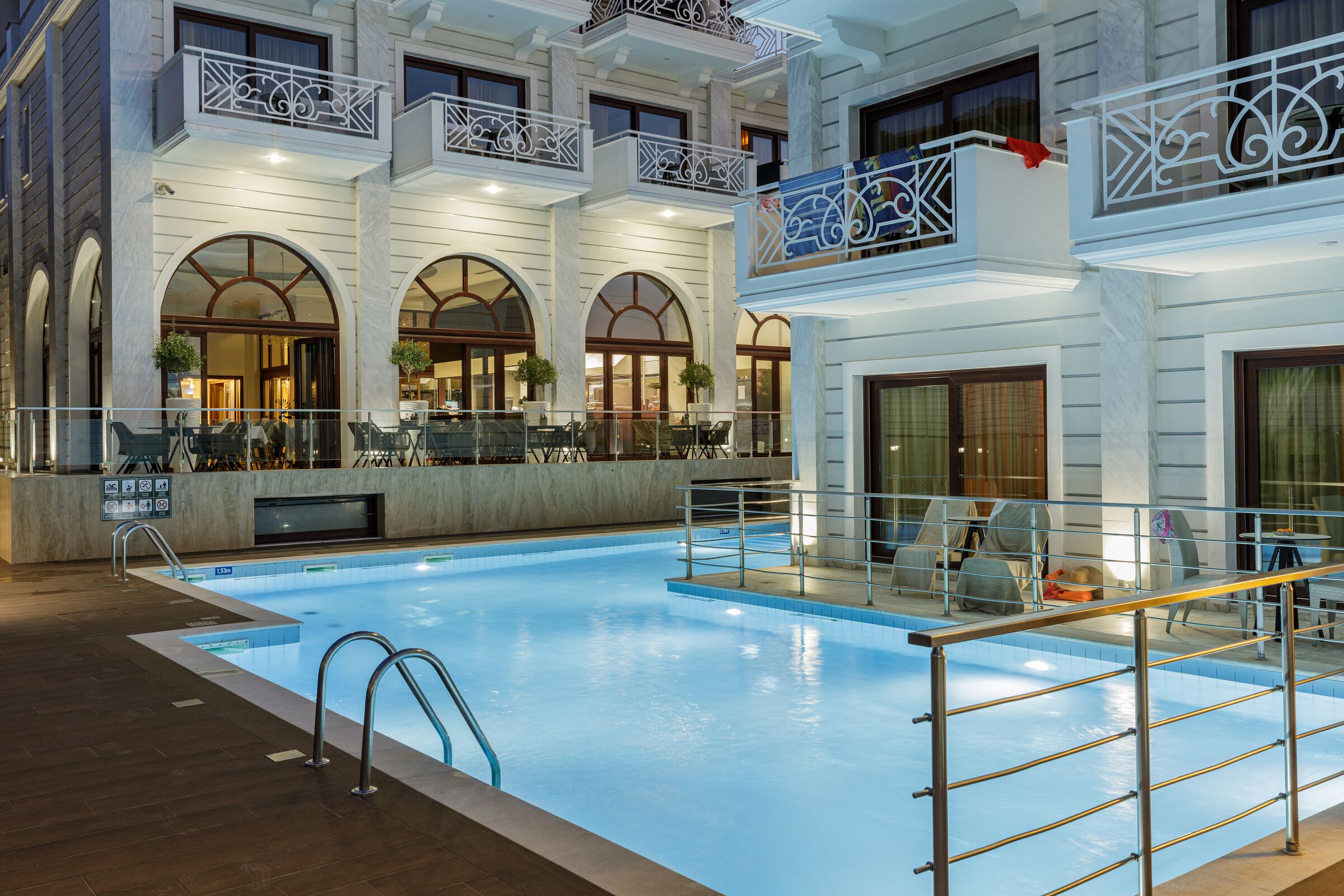 outdoor pool, open 8 am to 8 pm, pool loungers