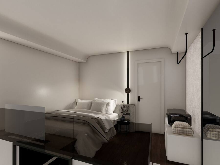 A modern bedroom with a bed, bedside table, and a wardrobe.